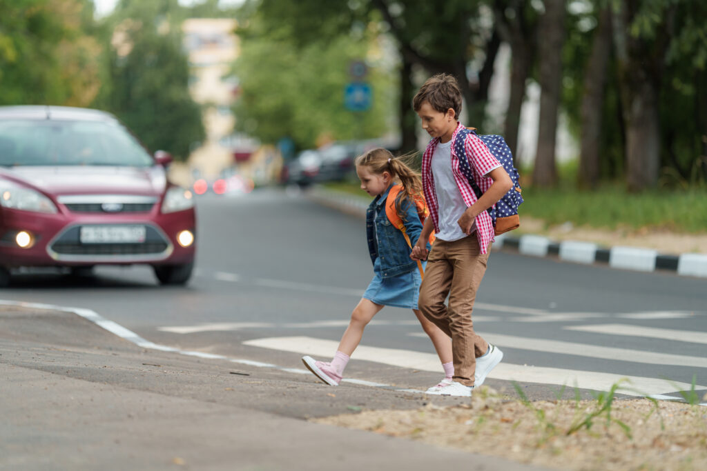 Children crossing the road without a guide