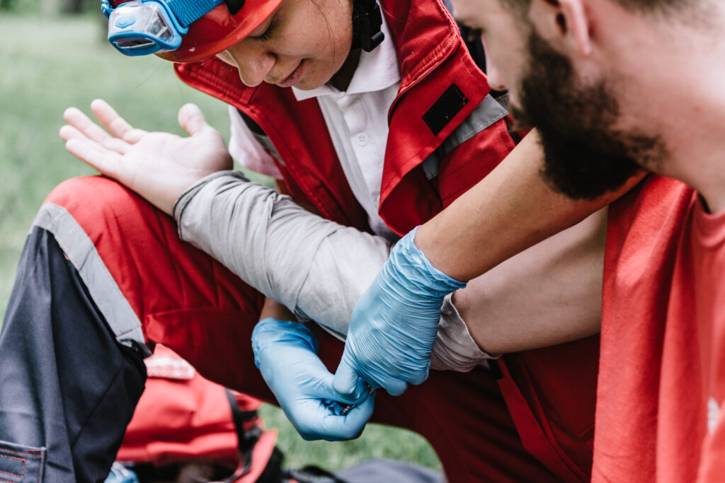 man getting burn wounds treated